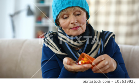 Portrait of older sick pensioner treated at home 105639923