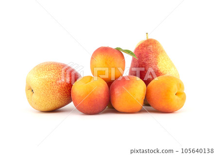 Apricots and multi-colored pear isolated on white Apricots and multi-colored pear isolated on white 105640138