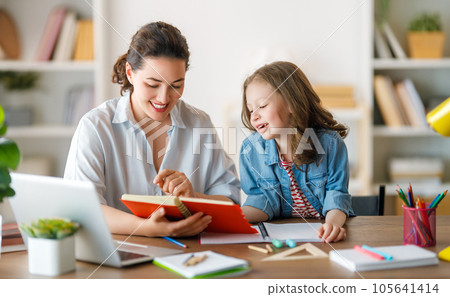 Girl doing homework or online education. Girl doing homework or online education. 105641414