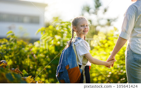 Parent and kid going to school Parent and kid going to school 105641424