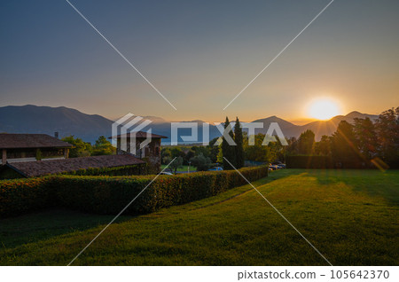 A landscape of the countryside near Iseo Lake at sunrise, Italy A landscape of the countryside near Iseo Lake at sunrise, Italy 105642370