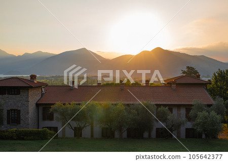 A landscape of the countryside near Iseo Lake at sunrise, Italy A landscape of the countryside near Iseo Lake at sunrise, Italy 105642377