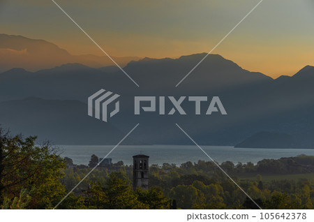 A landscape of the countryside near Iseo Lake at sunrise, Italy 105642378