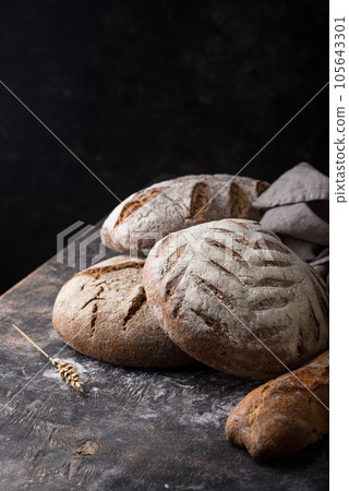 Fresh homemade bread with a crispy crust Fresh homemade bread with a crispy crust 105643301