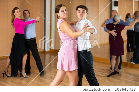 Young pair practicing ballroom dance in dance studio 105643438