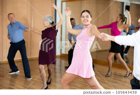 young woman with partner dance paso doble 105643439
