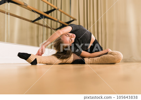 Ballerina in pointe pose. Beautiful ballet dancer stretching in class. Ballerina woman training Ballerina in pointe pose. Beautiful ballet dancer stretching in class. Ballerina woman training 105643838
