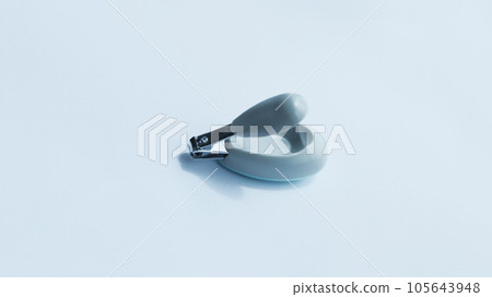 Small gray fancy nail clipper isolated on white for baby or kid. Small gray fancy nail clipper isolated on white for baby or kid. 105643948