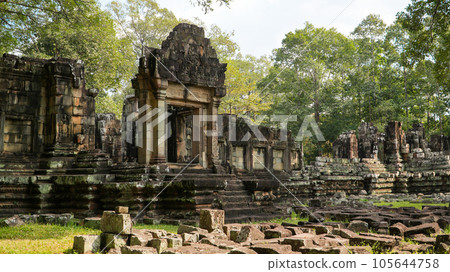 Ancient ruins Thom Bayon temple - famous Cambodian landmark, Angkor Wat complex of temples. Siem Reap, Cambodia. Ancient ruins Thom Bayon temple - famous Cambodian landmark, Angkor Wat complex of temples. Siem Reap, Cambodia. 105644758