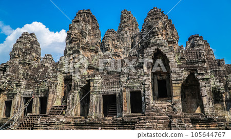 Ancient ruins Thom Bayon temple - famous Cambodian landmark, Angkor Wat complex of temples. Siem Reap, Cambodia. Ancient ruins Thom Bayon temple - famous Cambodian landmark, Angkor Wat complex of temples. Siem Reap, Cambodia. 105644767