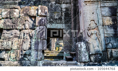 Ancient ruins Thom Bayon temple - famous Cambodian landmark, Angkor Wat complex of temples. Siem Reap, Cambodia. Ancient ruins Thom Bayon temple - famous Cambodian landmark, Angkor Wat complex of temples. Siem Reap, Cambodia. 105644768
