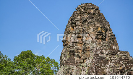 Ancient ruins Thom Bayon temple - famous Cambodian landmark, Angkor Wat complex of temples. Siem Reap, Cambodia. Ancient ruins Thom Bayon temple - famous Cambodian landmark, Angkor Wat complex of temples. Siem Reap, Cambodia. 105644770