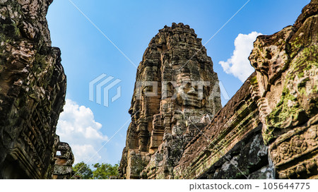 Ancient ruins Thom Bayon temple - famous Cambodian landmark, Angkor Wat complex of temples. Siem Reap, Cambodia. Ancient ruins Thom Bayon temple - famous Cambodian landmark, Angkor Wat complex of temples. Siem Reap, Cambodia. 105644775