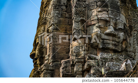 Ancient ruins Thom Bayon temple - famous Cambodian landmark, Angkor Wat complex of temples. Siem Reap, Cambodia. Ancient ruins Thom Bayon temple - famous Cambodian landmark, Angkor Wat complex of temples. Siem Reap, Cambodia. 105644776