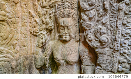 Ancient ruins Thom Bayon temple - famous Cambodian landmark, Angkor Wat complex of temples. Siem Reap, Cambodia. Ancient ruins Thom Bayon temple - famous Cambodian landmark, Angkor Wat complex of temples. Siem Reap, Cambodia. 105644779