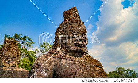 Ancient ruins Thom Bayon temple - famous Cambodian landmark, Angkor Wat complex of temples. Siem Reap, Cambodia. Ancient ruins Thom Bayon temple - famous Cambodian landmark, Angkor Wat complex of temples. Siem Reap, Cambodia. 105644784