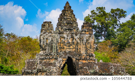 Ancient ruins Thom Bayon temple - famous Cambodian landmark, Angkor Wat complex of temples. Siem Reap, Cambodia. Ancient ruins Thom Bayon temple - famous Cambodian landmark, Angkor Wat complex of temples. Siem Reap, Cambodia. 105644788