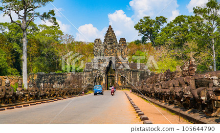 Ancient ruins Thom Bayon temple - famous Cambodian landmark, Angkor Wat complex of temples. Siem Reap, Cambodia. Ancient ruins Thom Bayon temple - famous Cambodian landmark, Angkor Wat complex of temples. Siem Reap, Cambodia. 105644790
