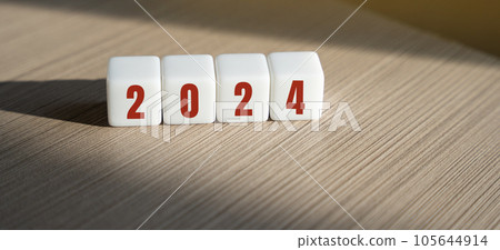 Wooden blocks with the inscription 2024. Setting goals and objectives for the new year. Planning, business management and strategy concept. Trends and ideas. Vision. 105644914