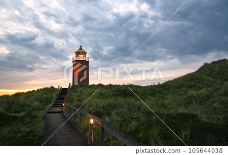 Lighthouse on the hilltop with wooden stairs on Sylt Island, Germany Lighthouse on the hilltop with wooden stairs on Sylt Island, Germany 105644938