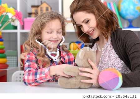 Cute little girl playing nurse 105645131
