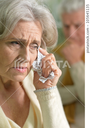Close-up portrait of a sad elder couple  105645135