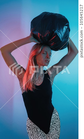 Information overload. Noise stress. Digital fatigue. Double exposure glitch motion silhouette of exhausted woman carrying heavy bag on head on blue pink gradient background. Information overload. Noise stress. Digital fatigue. Double exposure glitch motion silhouette of exhausted woman carrying heavy bag on head on blue pink gradient background. 105645217