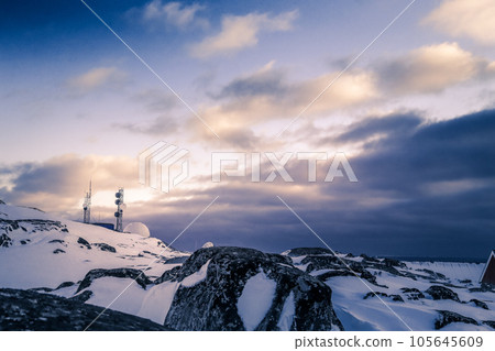 Arctic telecommunication station among snow rocks, Nuuk, Greenland 105645609