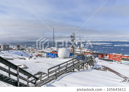 Stairs to the arctic station covered in snow and Nuuk city fjord view, Greenland 105645611