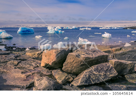 Huge blue icebergs drifting along the fjord, view from old harbor in Nuuk city, Greenland 105645614