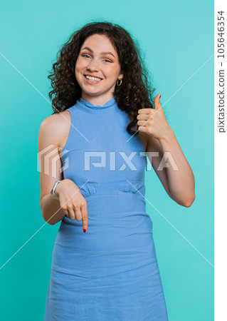 Woman pointing down, saying to subscribe, gesturing ok and like, promotional information below 105646354