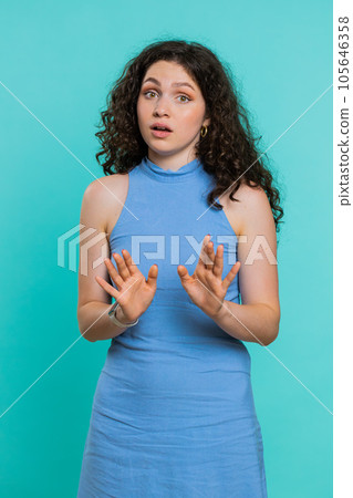 Young woman warning with admonishing finger gesture, saying no, be careful, slowly, avoid danger Young woman warning with admonishing finger gesture, saying no, be careful, slowly, avoid danger 105646358