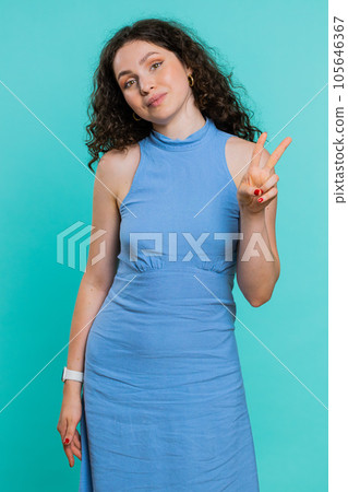 Woman girl showing victory V sign, hoping for success and win, doing peace gesture with two fingers Woman girl showing victory V sign, hoping for success and win, doing peace gesture with two fingers 105646367