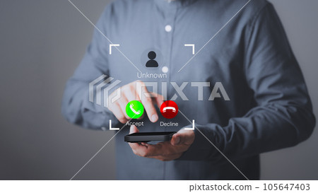 Man answering the incoming call. The phone call was from an unknown number. Call center gang or stranger. Hoax person with a fake identity. Concept of scam, fraud with a smartphone from the criminal. Man answering the incoming call. The phone call was from an unknown number. Call center gang or stranger. Hoax person with a fake identity. Concept of scam, fraud with a smartphone from the criminal. 105647403