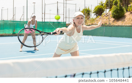 Senior woman plays tennis 105648441