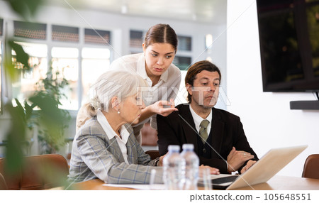 Adult man, elderly and young women having meeting in office 105648551