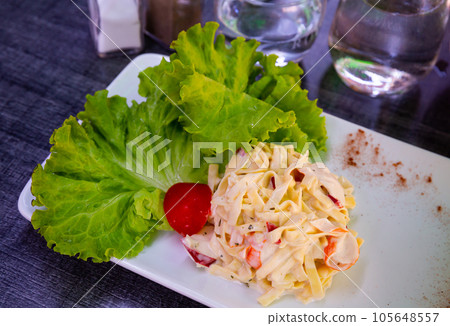 Pasta salad with surimi meat, italian cuisine 105648557