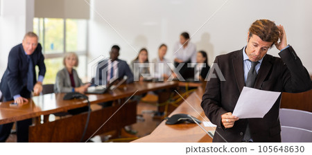 Sad middle aged white brunette businessman being reprimanded and fired 105648630