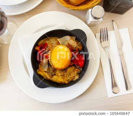 Traditional Spanish vegetable escalibada with melted goat cheese 105648647