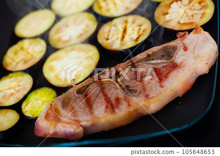 Delicious pork with eggplant frying on grill, steam 105648653