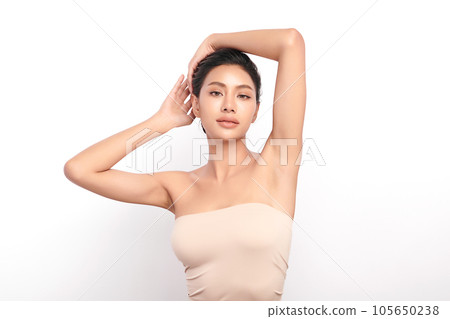 Beautiful Young woman lifting hands up to show off clean and hygienic armpits or underarms on white background, Smooth armpit cleanliness and protection concept Beautiful Young woman lifting hands up to show off clean and hygienic armpits or underarms on white background, Smooth armpit cleanliness and protection concept 105650238