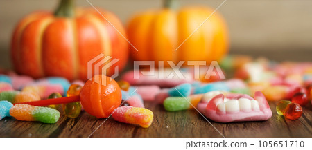 Happy Halloween day with ghost candies, pumpkin, Jack O lantern and decorative (selective focus). Trick or Threat, Hello October, fall autumn, Festive, party and holiday concept 105651710