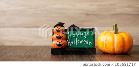 Orange pumpkin on table with copy space for banner background. Happy Halloween day, Hello October, fall autumn season, Festive, party and holiday concept 105651717