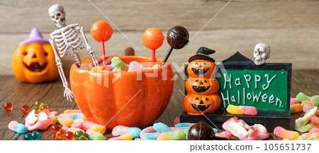 Happy Halloween day with ghost candies, pumpkin bowl, Jack O lantern and decorative (selective focus). Trick or Threat, Hello October, fall autumn, Festive, party and holiday concept Happy Halloween day with ghost candies, pumpkin bowl, Jack O lantern and decorative (selective focus). Trick or Threat, Hello October, fall autumn, Festive, party and holiday concept 105651737