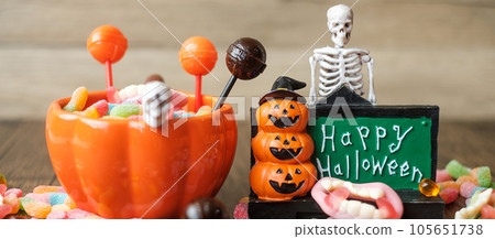 Happy Halloween day with ghost candies, pumpkin bowl, Jack O lantern and decorative (selective focus). Trick or Threat, Hello October, fall autumn, Festive, party and holiday concept Happy Halloween day with ghost candies, pumpkin bowl, Jack O lantern and decorative (selective focus). Trick or Threat, Hello October, fall autumn, Festive, party and holiday concept 105651738