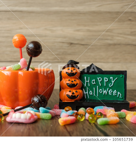 Happy Halloween day with ghost candies, pumpkin bowl, Jack O lantern and decorative (selective focus). Trick or Threat, Hello October, fall autumn, Festive, party and holiday concept Happy Halloween day with ghost candies, pumpkin bowl, Jack O lantern and decorative (selective focus). Trick or Threat, Hello October, fall autumn, Festive, party and holiday concept 105651739