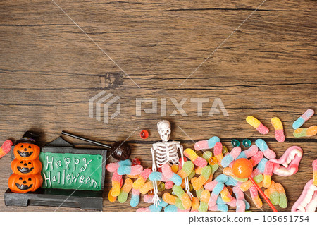 Happy Halloween day with ghost candies, pumpkin, bowl and decorative. Trick or Threat, Hello October, fall autumn, Festive, party and holiday concept Happy Halloween day with ghost candies, pumpkin, bowl and decorative. Trick or Threat, Hello October, fall autumn, Festive, party and holiday concept 105651754