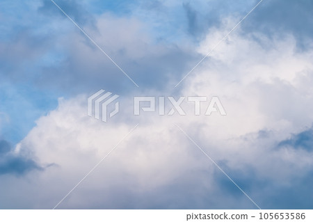 Blue sky background with white and pink clouds at sunset. High quality photo 105653586