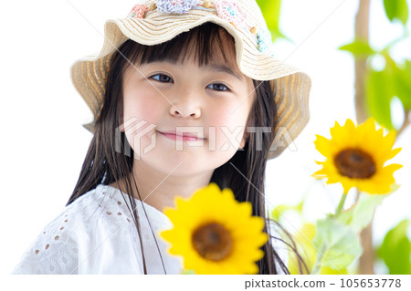 Girl's portrait A girl holding a sunflower Girl's portrait A girl holding a sunflower 105653778