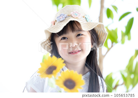 Girl's portrait A girl holding a sunflower Girl's portrait A girl holding a sunflower 105653785